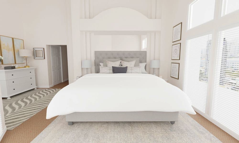 A contemporary bedroom with soothing pastels and statement decor